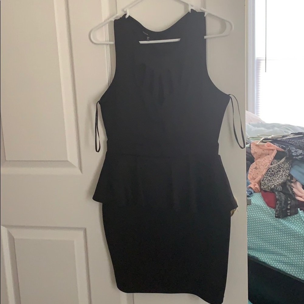 Tight black peplum dress with heart opening